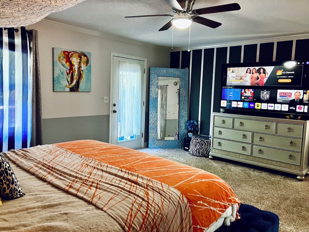 Zen Villa bedroom with TV, comfortable for long furnished stays