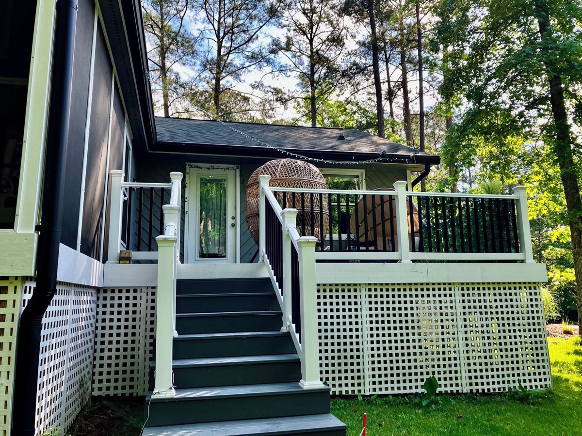 Zen Villa exterior porch with hanging egg chair among Georgia pines